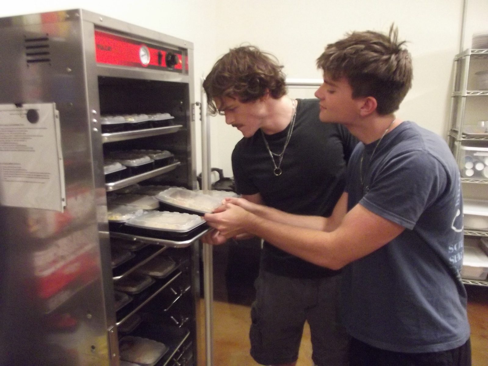 Loading meals into the warming cabinet