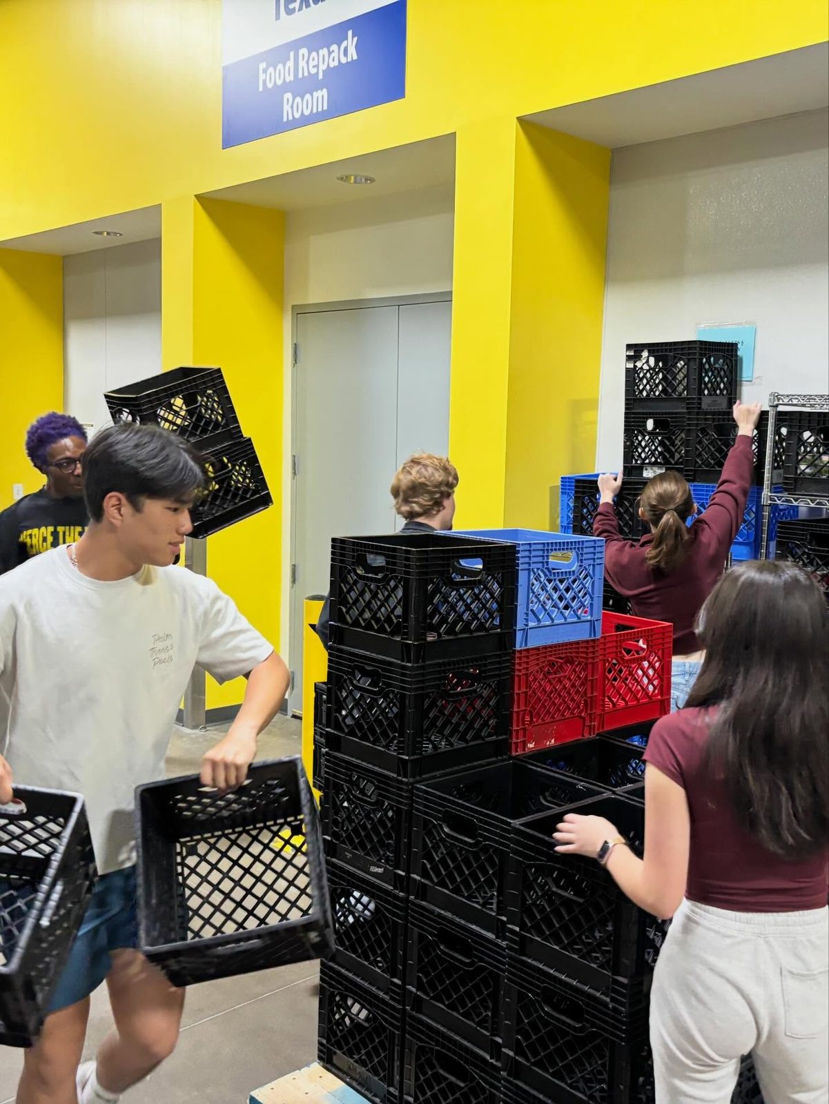 Stacking crates in the food repack room